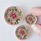 miniature pink floral plates with intricate designs inspired by William Morris, perfect for dollhouse and fairy garden decor.