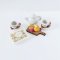 Miniature tea set with dessert and chocolates, perfect for 1:12 scale dollhouse tea party or kitchen decor.