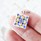 Handcrafted miniature ceramic tiles with intricate blue and yellow patterns for 1:12 scale dollhouse decor.