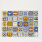 Handcrafted miniature ceramic tiles with intricate orange, blue, and yellow floral patterns. Set of 22 pieces, perfect for 1:12 scale dollhouse decor.