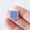 Set of 16 miniature ceramic tiles featuring a bold blue geometric floral pattern. Perfect for 1:12 scale dollhouse decor.