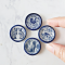 Set of four miniature ceramic plates with intricate blue animal designs, featuring cats, dogs, birds, and roosters, perfect for dollhouse decor.