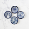 Set of four miniature ceramic plates with intricate blue animal designs, featuring cats, dogs, birds, and roosters, perfect for dollhouse decor.