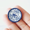 Handmade miniature ceramic plates with vintage blue and white animal motifs, suitable for dollhouse enthusiasts and collectors.