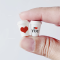 Set of two miniature coffee cups with love-themed designs, featuring 'I ❤️ YOU' and a heart, perfect for Valentine's Day dollhouse decor