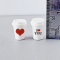 Set of two miniature coffee cups with love-themed designs, featuring 'I ❤️ YOU' and a heart, perfect for Valentine's Day dollhouse decor