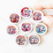 Set of nine miniature ceramic plates featuring adorable animals and rainbow designs, perfect for dollhouse decor or collectible gifts.