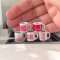 Set of five miniature ceramic mugs with Valentine's designs, featuring 