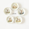 miniature decorative plates featuring adorable Easter bunny illustrations with floral backgrounds. Ideal for dollhouse collectors and festive displays.