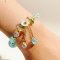 Light Blue Beaded Bracelet with White Flower Charm