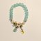 Light Blue Beaded Bracelet with White Flower Charm
