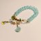 Light Blue Beaded Bracelet with White Flower Charm