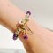 Purple Beaded Bracelet with White Flower Charm