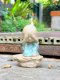 Three ceramic novice monk statues