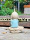 Three ceramic novice monk statues