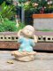 Three ceramic novice monk statues