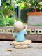 Three ceramic novice monk statues