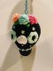 Black skull keychain with blue eye