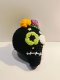 Black skull keychain with green eye