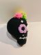 Black skull keychain with purple eye
