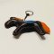Dark brown horse keychain with an orange tail