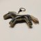 Black horse keychain with a gray tail