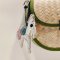 White horse keychain with a pink tail