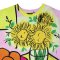 Over size t-shirt - Yellow : Colorful fruit plates beside a sunflower vase on the dining table.