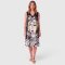 Woman Sleeveless Dress - Black : Woman stands gracefully with intricate black lines.