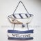ป้ายไม้ Welcome เรือพายริ้วขาวน้ำเงิน แนวทะเล