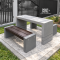 ชุดโต๊ะสนามไฟเบอร์ท็อปทูโทน CONC Concreation โต๊ะไฟเบอร์สีเทาปูน พร้อมม้านั่ง CONWOOD สีไม้โอ๊คเข้ม ฐานปูนซีเมนต์ 2 ตัว จัดวางในสวนกลางแจ้ง