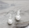Baby octopus holding Pearl silver earrings