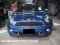 Mini r58 coopers blue decorated with stickers.