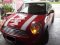 Mini Cooper สีแดงคาดเส้นคู่ขาวเงาลายคลาสสิค