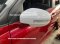 Suzuki Swift Eco Car red with white stickers around the car